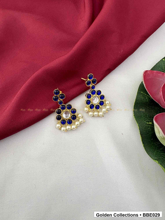 Angled product view of Blue Stone Pearl Real Kemp Jhumki Earrings from Golden Collections