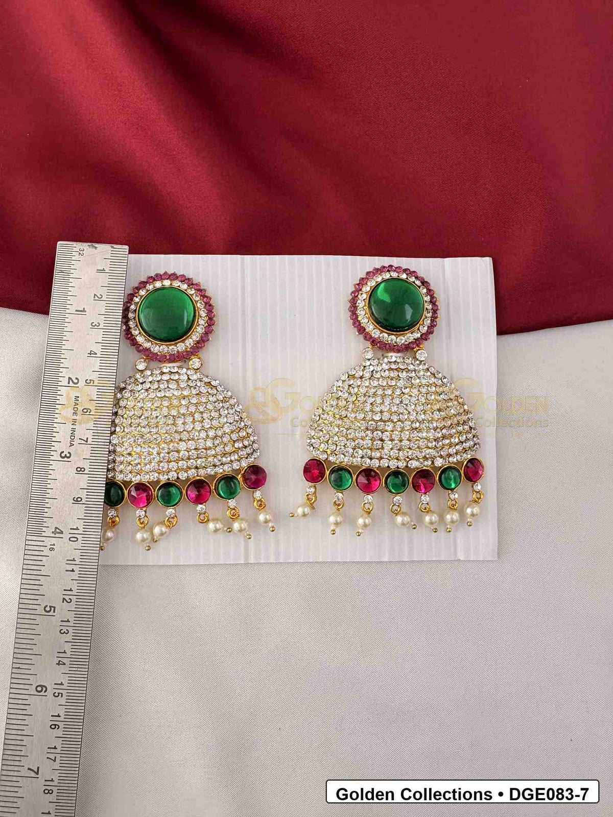 Measurement photo showing 11 Cms dome deity earrings with pink green stones for idol alankaram for deity idol alankaram