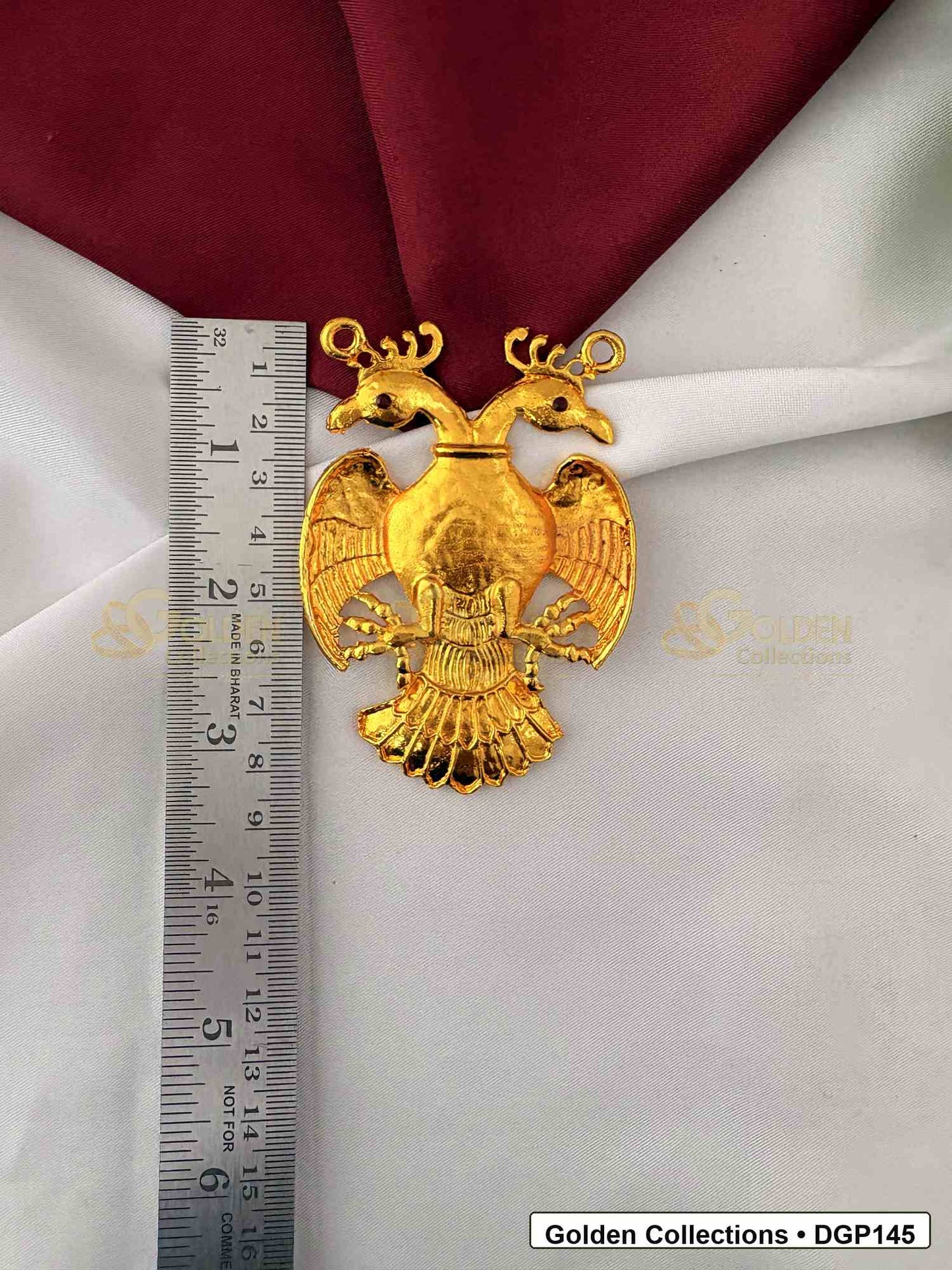 Measurement photo showing 3 x 2.25 Inches garuda motif deity pendant for idol alankaram with ruler for idol alankaram