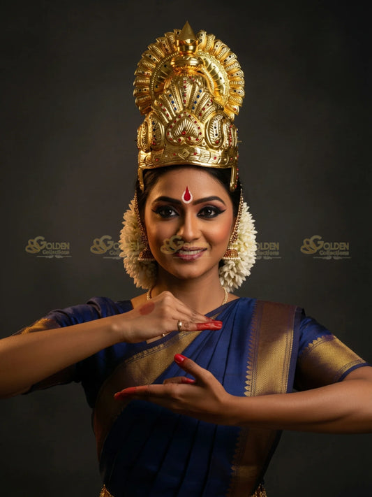 Golden Collections Gold Plated Bharatanatyam Crown - Model in blue saree with traditional makeup and flowers.