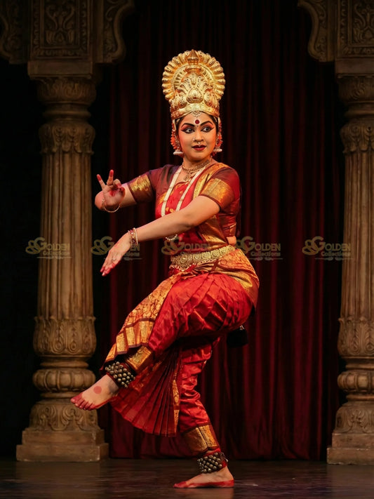 Golden Collections God-Goddess multicolor stone Mahapaksha crown on a Bharatanatyam dancer, showcasing its regal fit and stage presence.