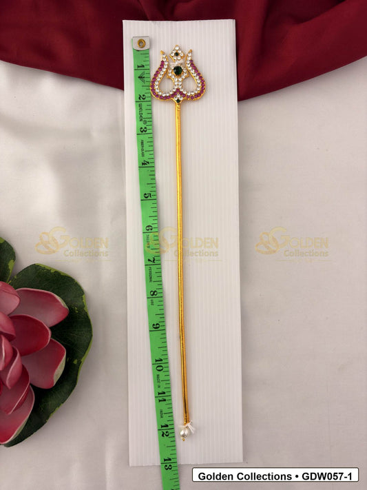 Measurement photo showing 12 Inches gold-tone trishul for idol alankaram with measuring tape for idol alankaram