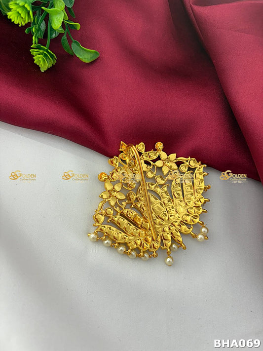 Gold plated Kemp Rakodi crown with red and green stones