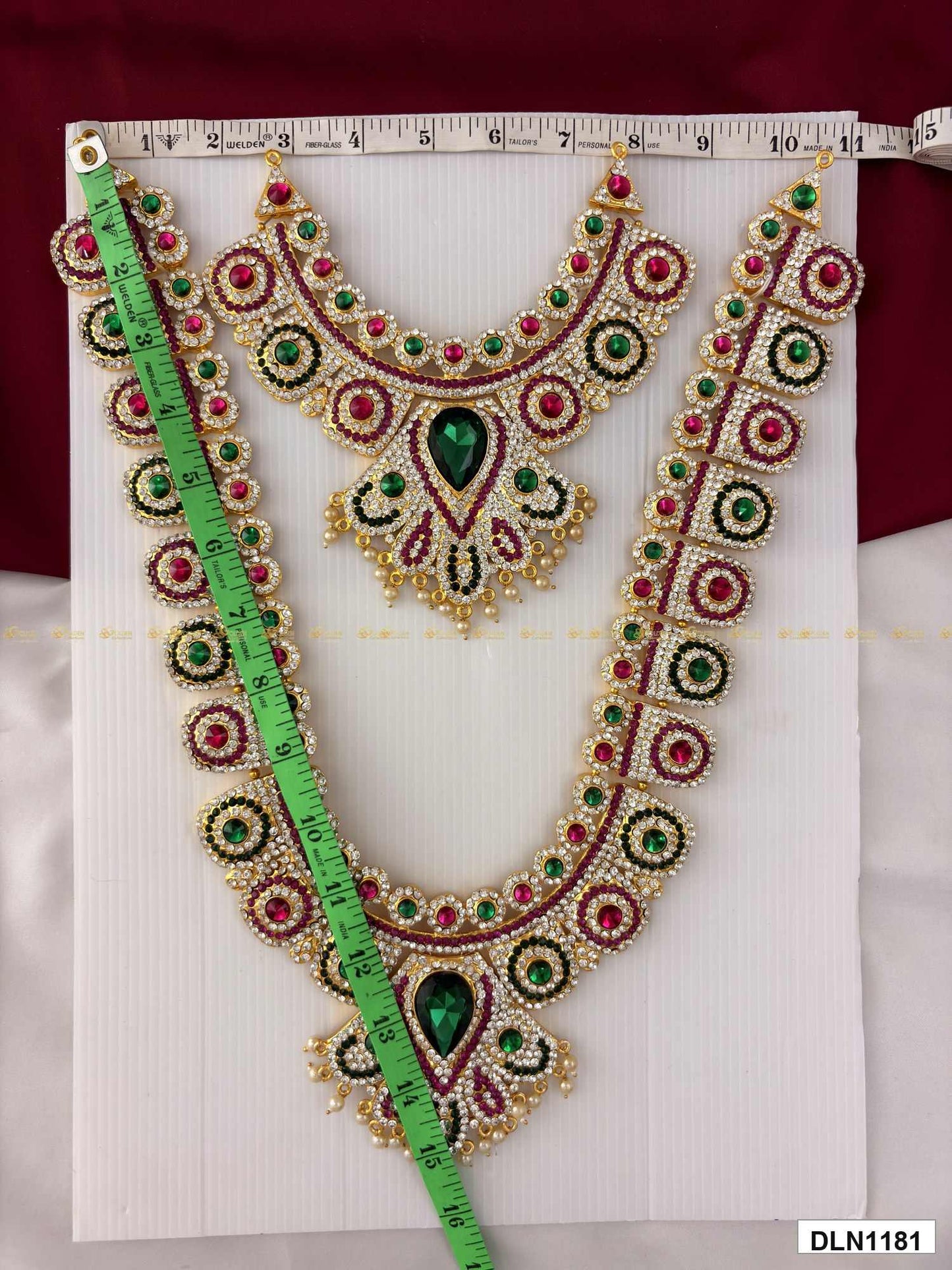 Measurement photo of deity long haram set with measuring tape for idol alankaram size reference