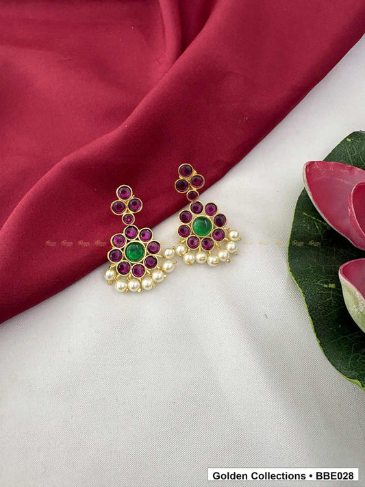 Angled product view of Red Green Stone Real Kemp Jhumki Earrings from Golden Collections