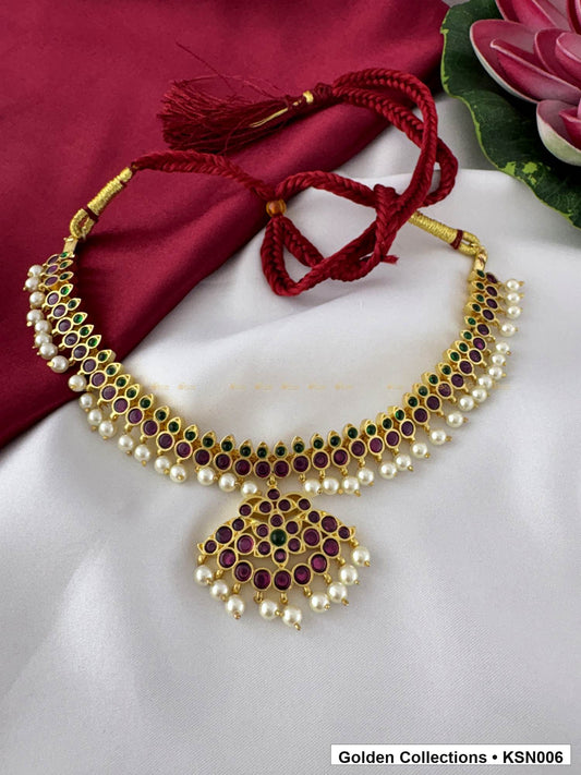 Angled product view of Red Stone Real Kemp Crescent Necklace with Pearl Border from Golden Collections