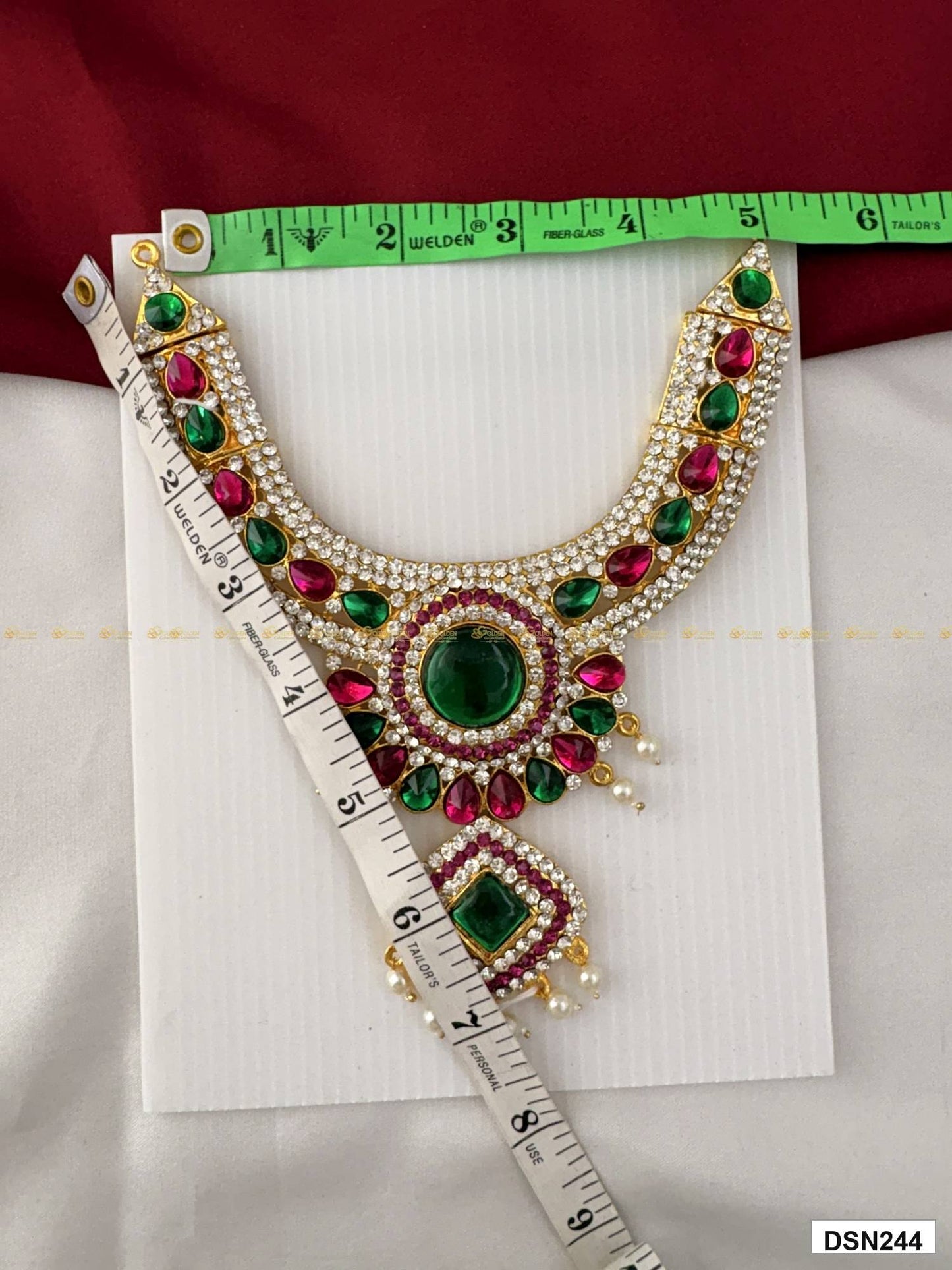 Measurement photo of deity short haram with measuring tape for idol alankaram size reference