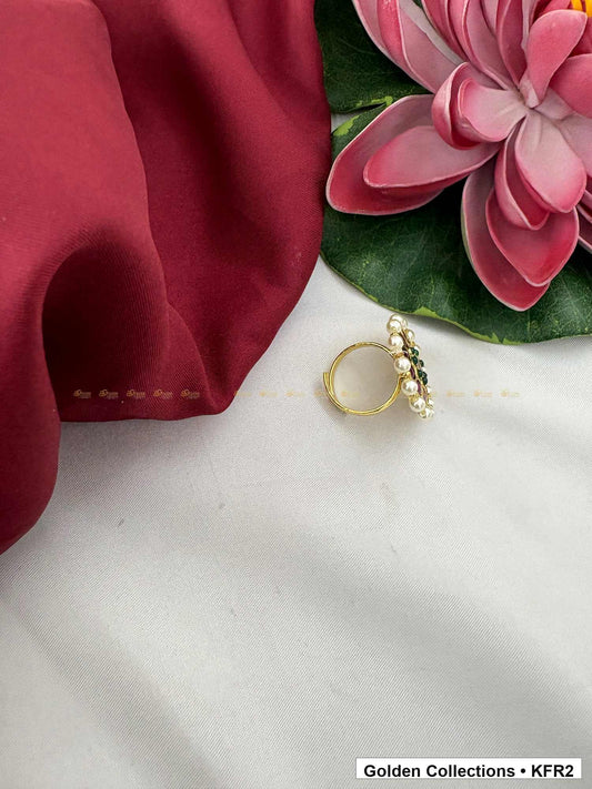 Angled product view of Round Real Kemp Finger Ring with Red Green Stones from Golden Collections