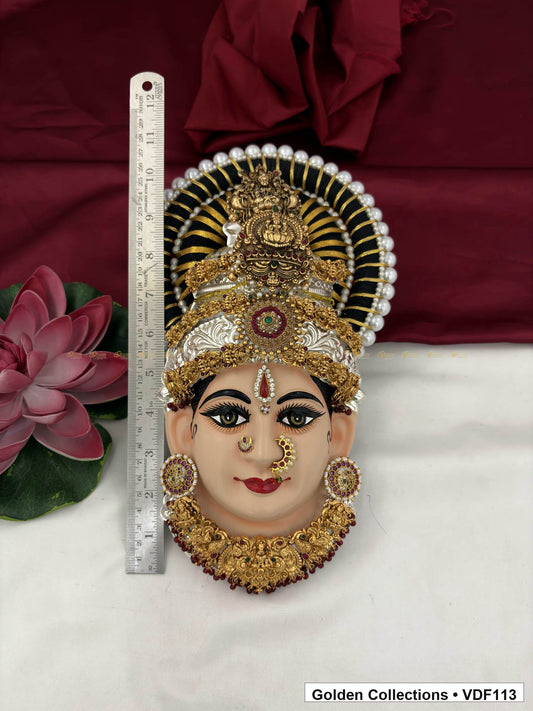 Measurement view of Varalakshmi Tanjore Face with Red-Green Centre Crown and Maroon Fringe Necklace with ruler beside the product