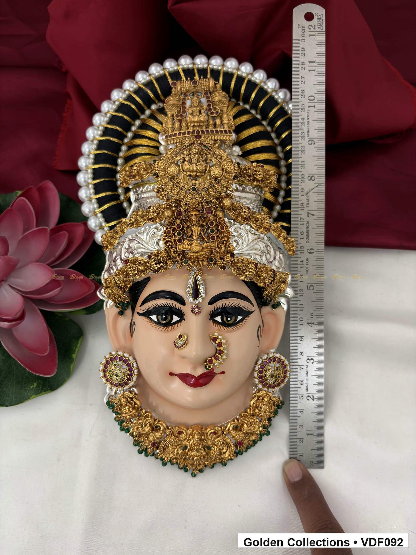 Varalakshmi Tanjore Face with Tall Sculpted Crown and Green Fringe Necklace close-up detail view