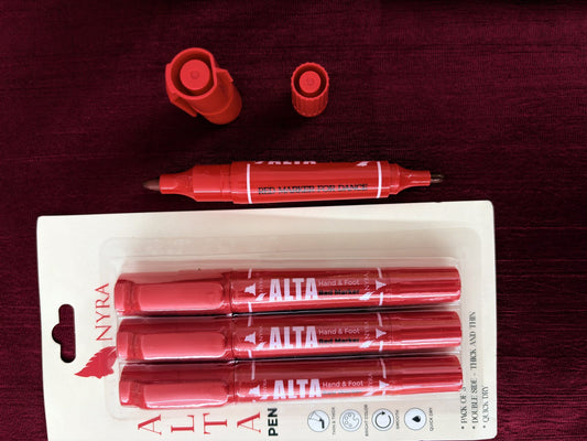 Nyra red alta pen pack displayed on maroon fabric with one double-sided red marker open beside it.