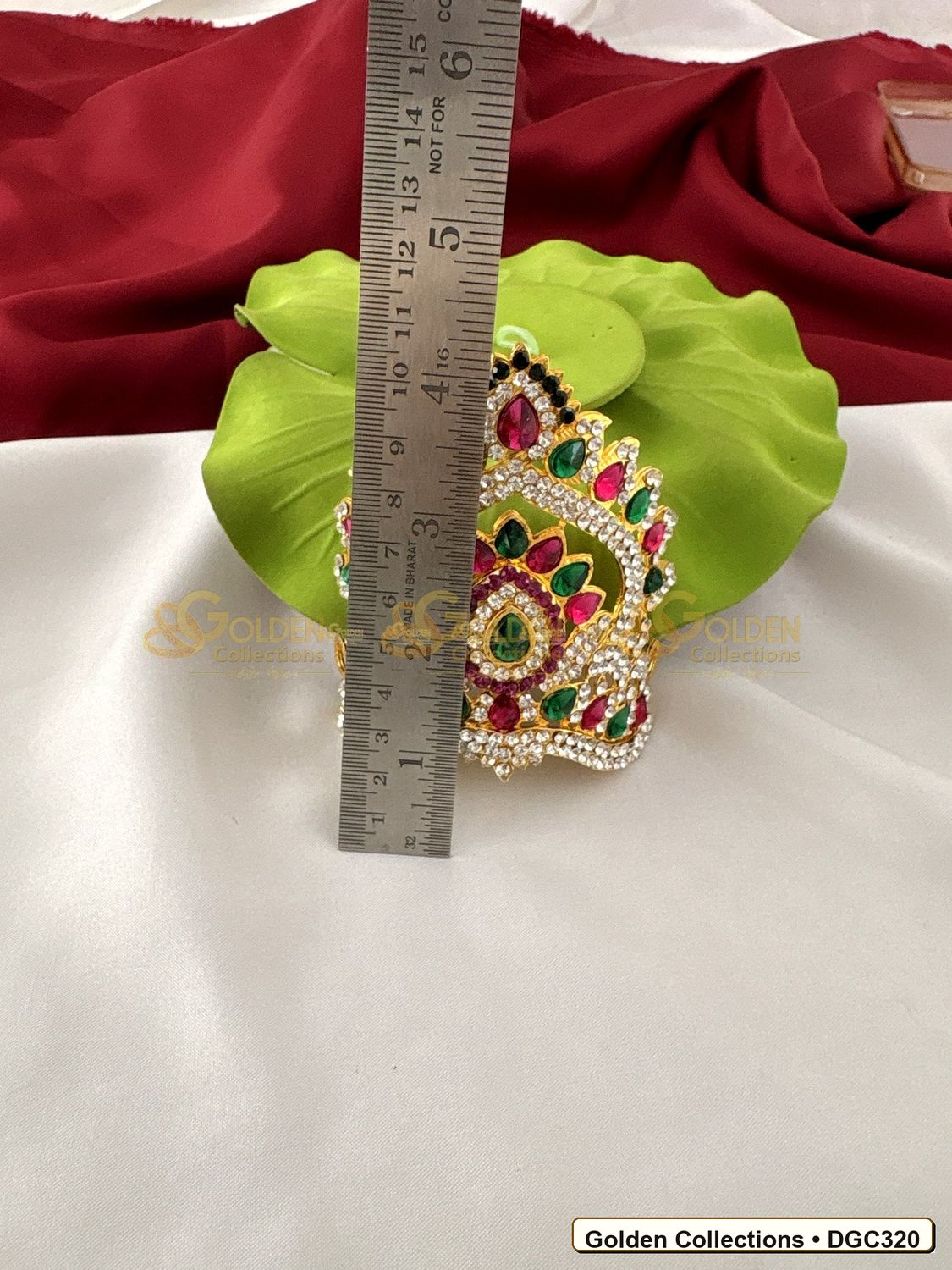 Angled view of Small Arch Deity Crown Mukut with Pink Green Stones 3.5 x 4 x 3 inches DGC320 from Golden Collections