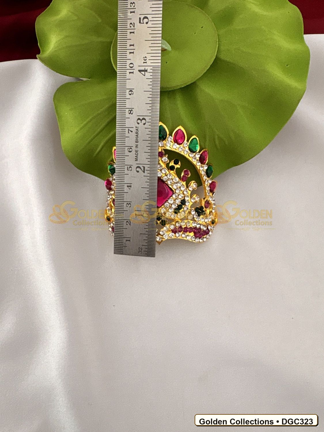 Angled view of Small Arch Deity Crown Mukut with Pink Center Stone 2.5 x 3.5 x 2.75 inches DGC323 from Golden Collections