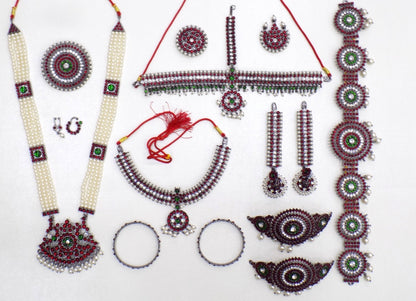 Antique temple jewellery set with Kemp stones, pearls, haram, choker, bangles, vaddanam, rakodi and ornaments for Bharatanatyam dancers
