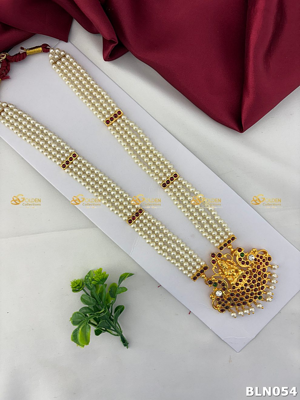 bharatanatyam pearl long haram with lakshmi peacock kemp pendant and ruby stones
