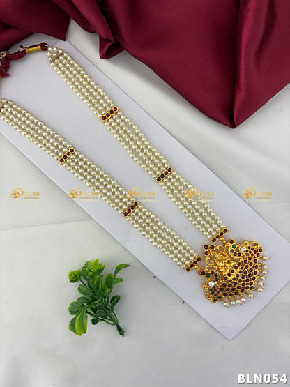 bharatanatyam pearl long haram with lakshmi peacock kemp pendant and ruby stones
