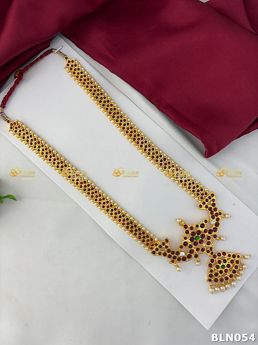 bharatanatyam pearl long haram with peacock kemp pendant and ruby stones
Goldencollections