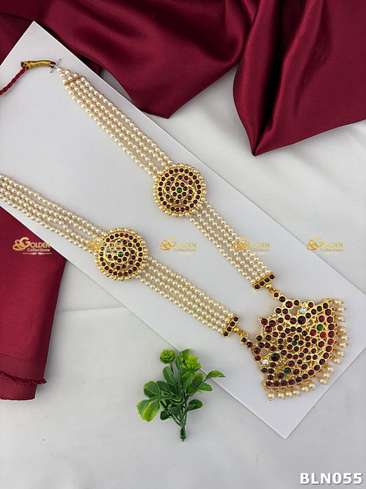 bharatanatyam pearl long haram with round kemp discs and ruby green temple pendant
