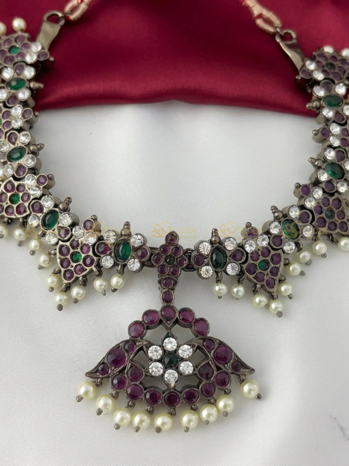 Golden Collections Black Kemp Short Necklace - Detailed view highlighting the precise hand-setting of the genuine ruby, emerald, and white kemp stones and the delicate genuine pearl drops along the entire necklace.