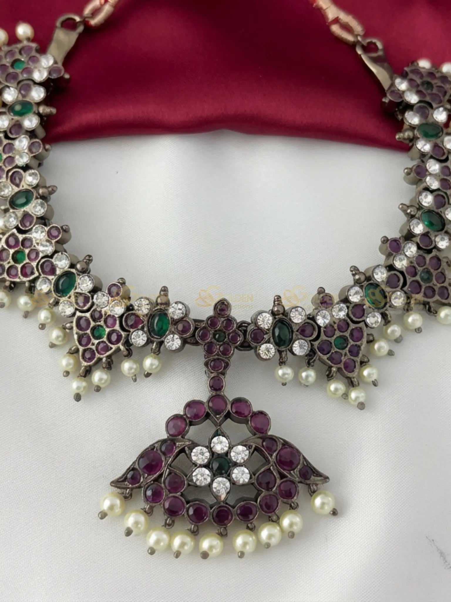 Golden Collections Black Kemp Short Necklace - Detailed view highlighting the precise hand-setting of the genuine ruby, emerald, and white kemp stones and the delicate genuine pearl drops along the entire necklace.
