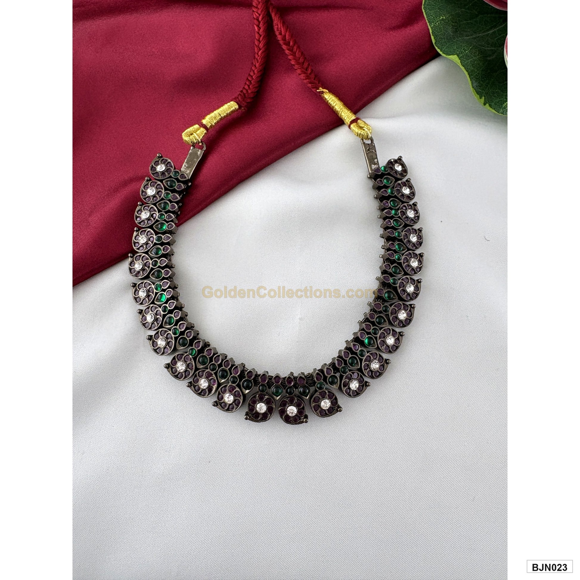 Black kemp green purple short necklace with red tie cord angled view BJN023