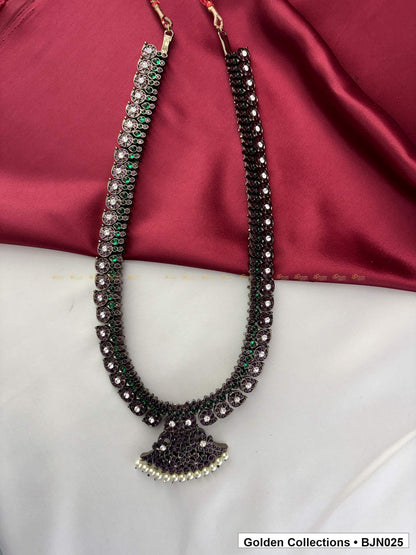 Angled view of Black Kemp Long Haram Necklace for Bharatanatyam from Golden Collections