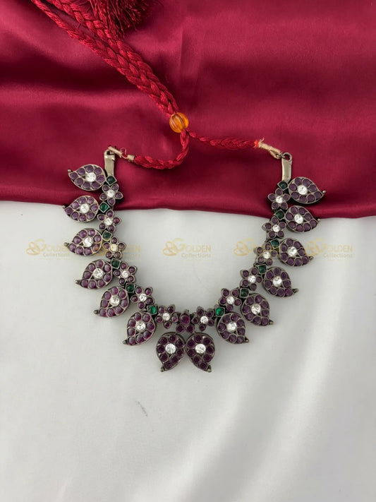 Golden Collections Black Kemp Short Necklace - Front view showcasing the aubergine and green genuine kemp stones in a mango leaf pattern.