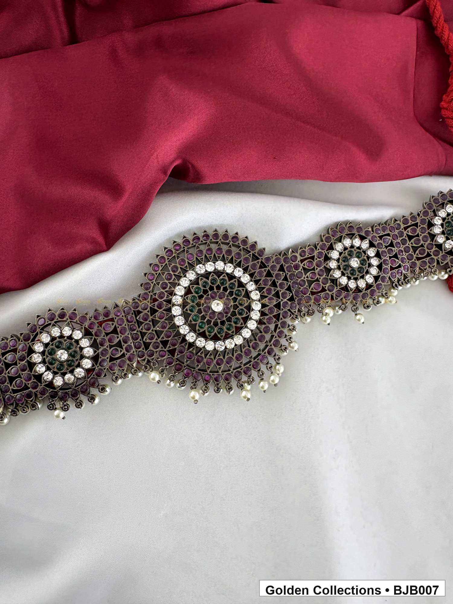 angled product view of Black kemp round medallion vaddanam oddiyanam from Golden Collections