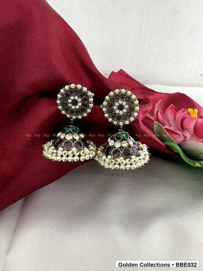Angled view of Black Kemp Three Line Jhumki Earrings for Bharatanatyam from Golden Collections