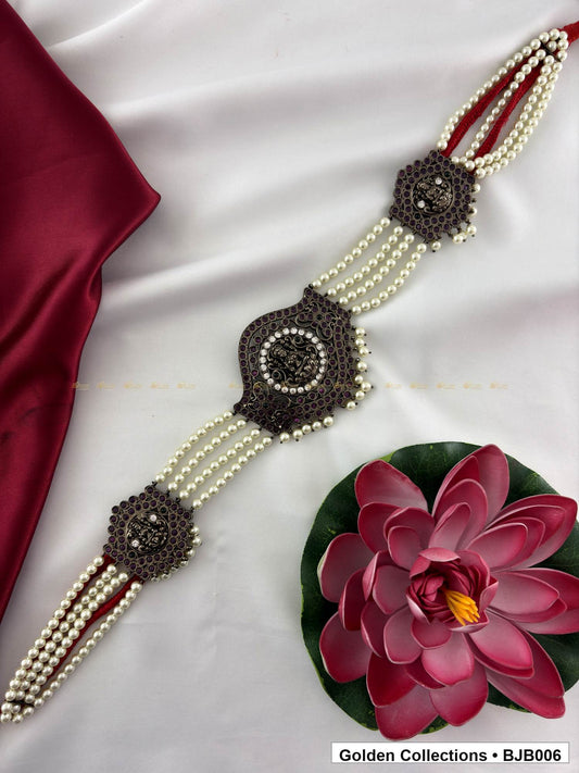 angled product view of Black kemp vaddanam oddiyanam with pearl strands from Golden Collections