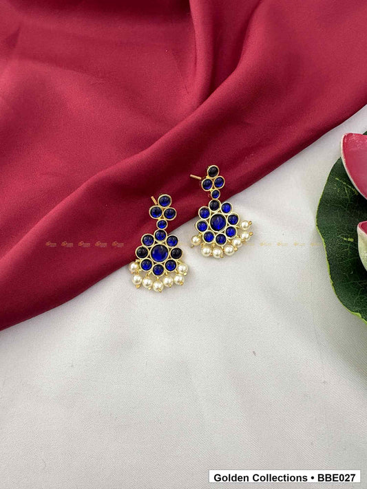 Angled product view of Blue Stone Real Kemp Jhumki Earrings from Golden Collections