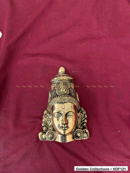 Brass Varalakshmi Face with Tall Embossed Crown and Circular Earrings alternate front view on burgundy fabric