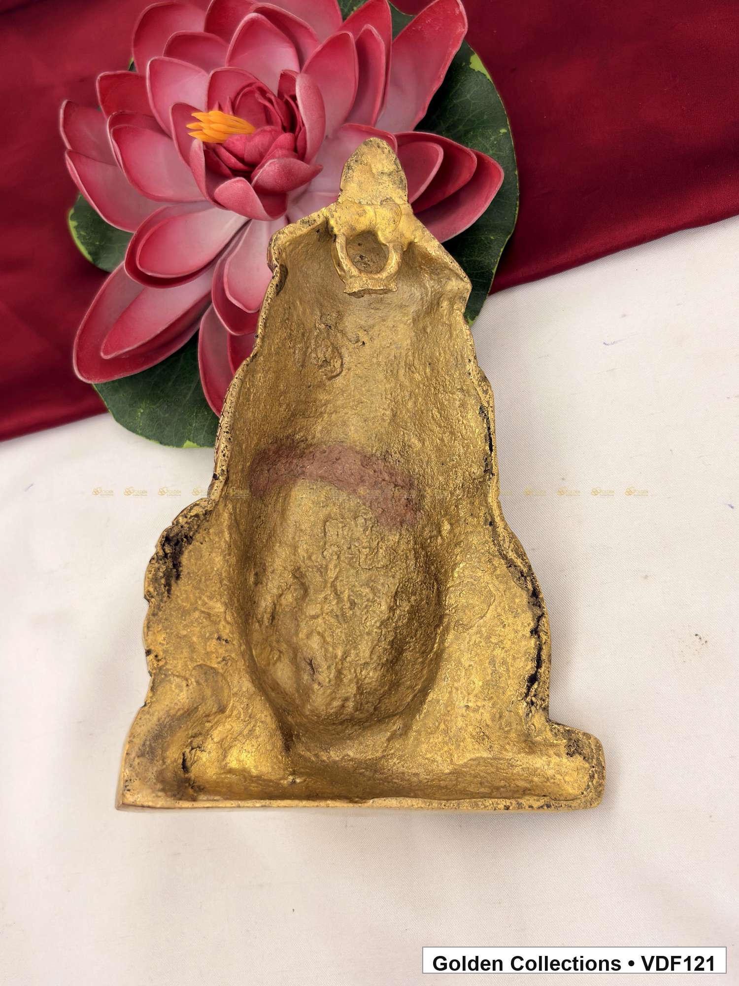 Back view of Brass Varalakshmi Face with Tall Embossed Crown and Circular Earrings showing the rear surface