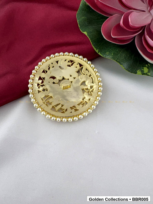 Angled product view of Circular Real Kemp Rakodi with Red Green Stone Work from Golden Collections