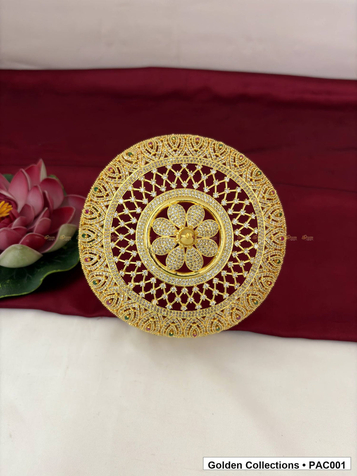 Front view of one full-round CZ deity umbrella showing the circular open lattice, central floral motif, patterned outer border, and colored accent details.
