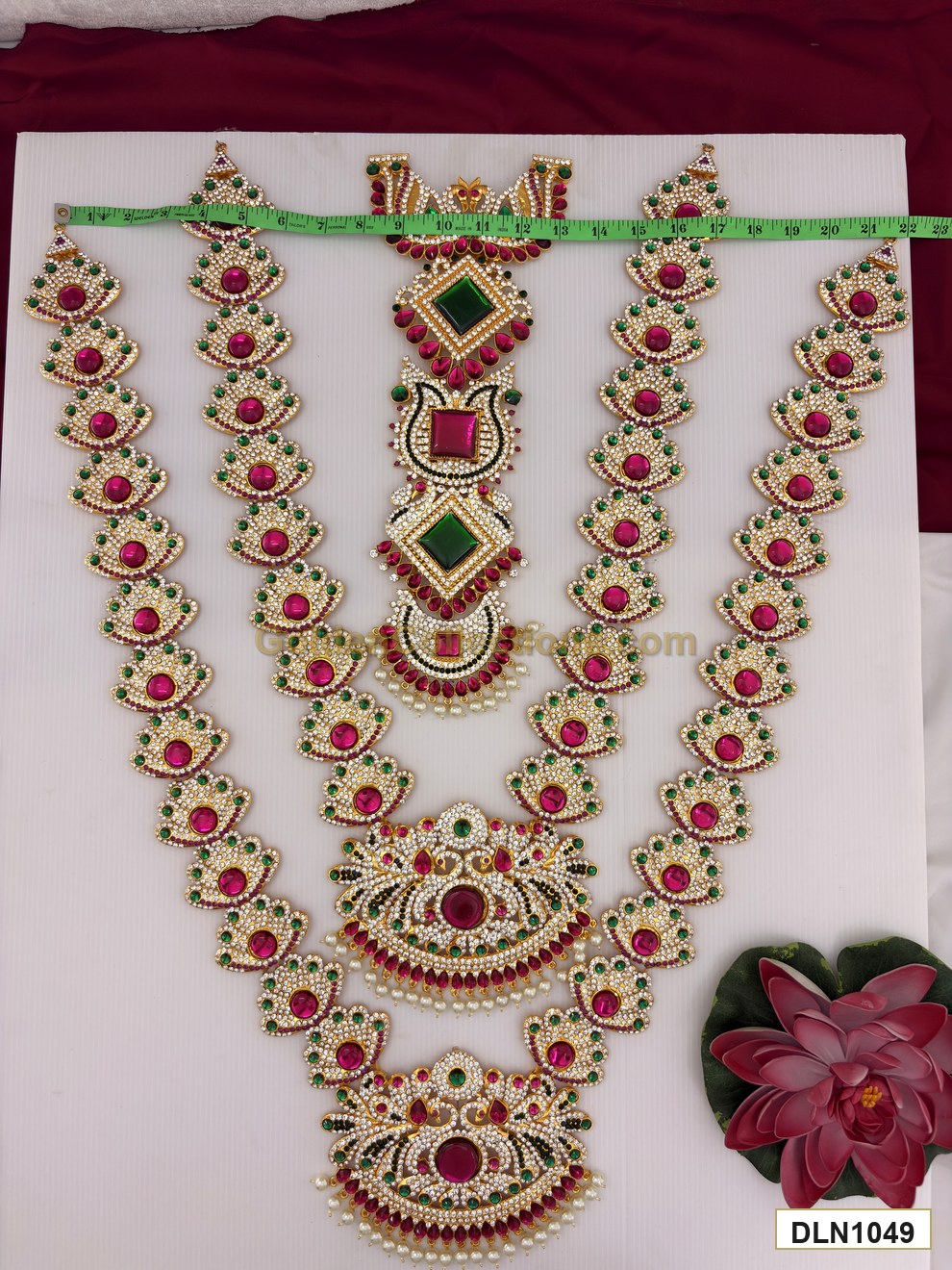 Width measurement photo showing 22 inch deity long haram set with measuring tape for idol alankaram