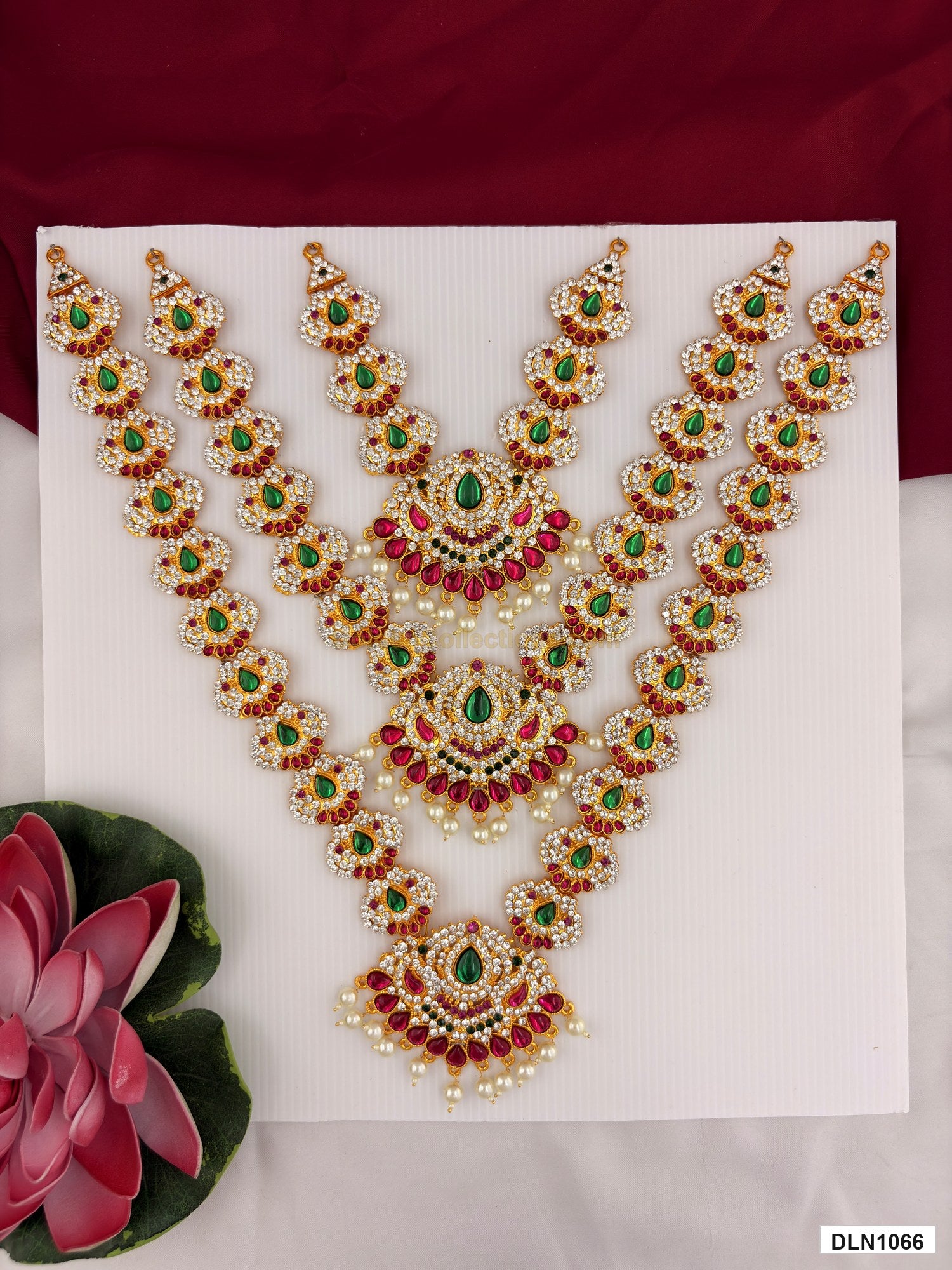 3 step deity long haram DLN1066 full product view with mixed green, pink and gold stone work and gold plating for idol alankaram