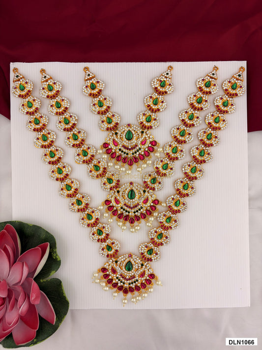 3 step deity long haram DLN1066 full product view with mixed green, pink and gold stone work and gold plating for idol alankaram