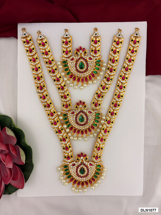3 step deity long haram DLN1077 full product view with mixed green, pink and gold stone work and gold plating for idol alankaram