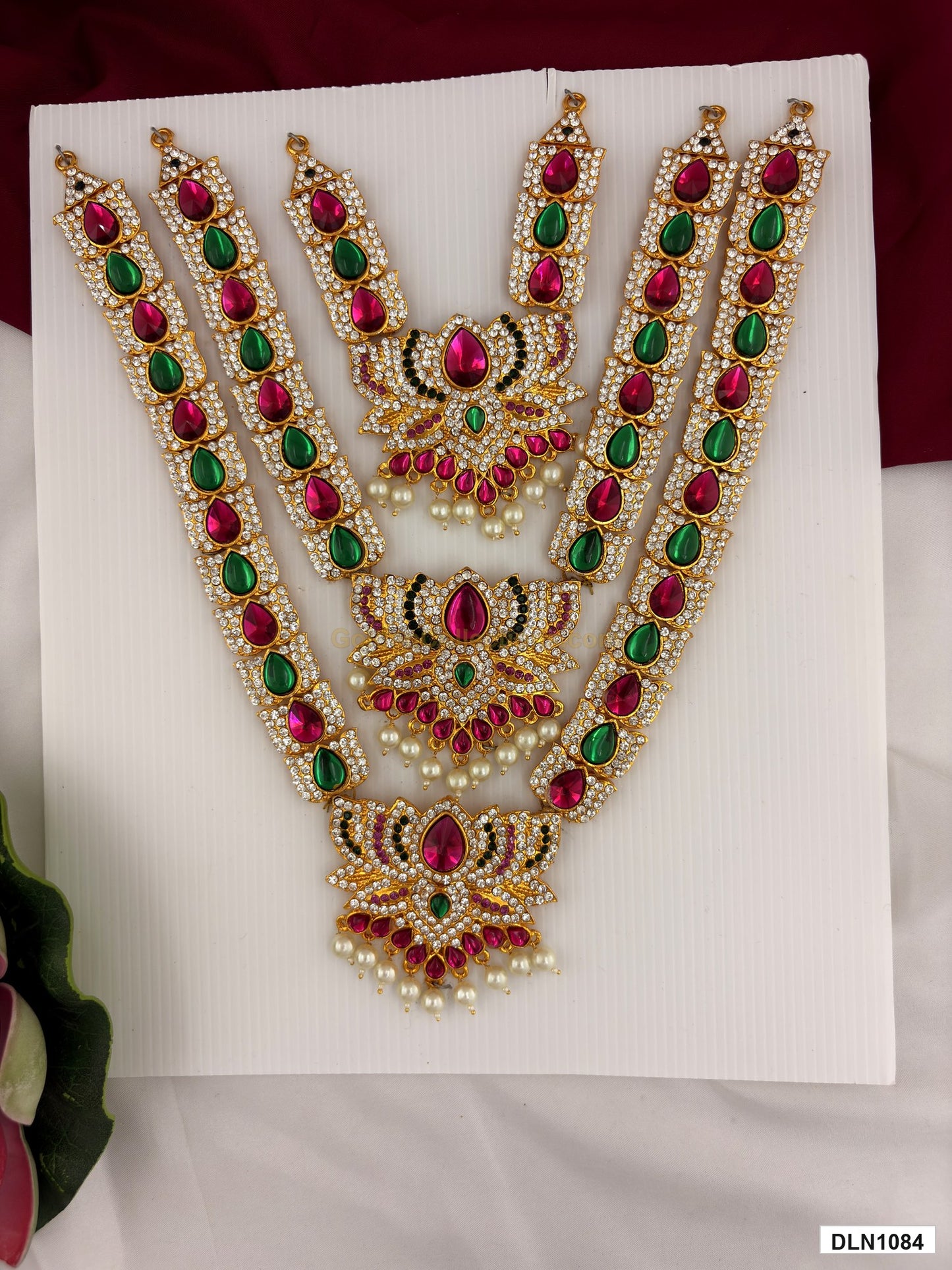 3 step deity long haram DLN1084 full product view with pink, green and gold stone work and gold plating for idol alankaram