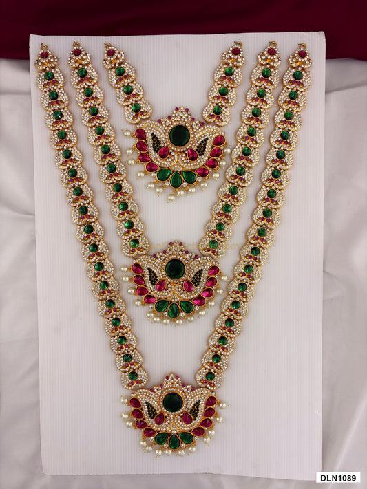 3 step deity long haram DLN1089 full product view with mixed green, pink and gold stone work and gold plating for idol alankaram