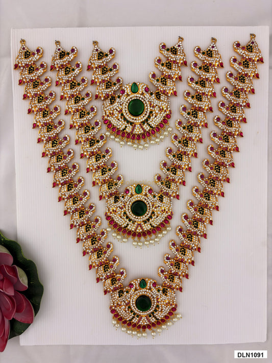 3 step deity long haram DLN1091 full product view with mixed green, pink and gold stone work and gold plating for idol alankaram