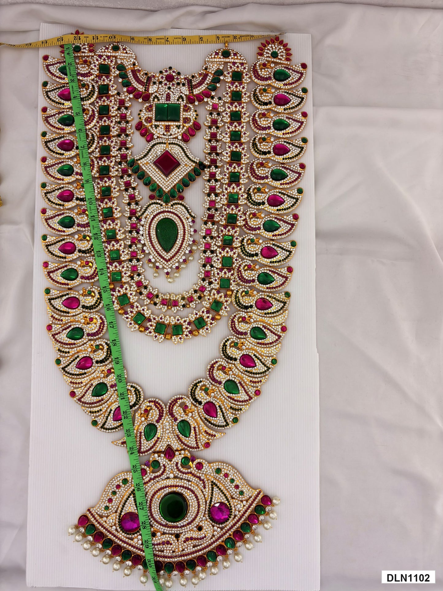 Measurement photo showing 31 x 12 Inches deity long haram with measuring tape for idol alankaram
