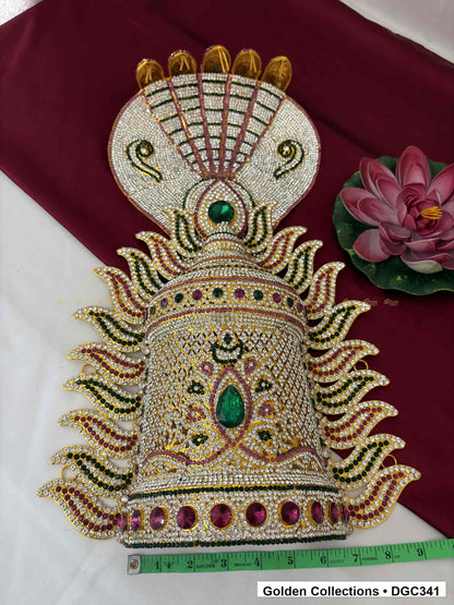 Front view of crown with a horizontal measuring tape below the base, showing the central green teardrop accent and pink round base stones.