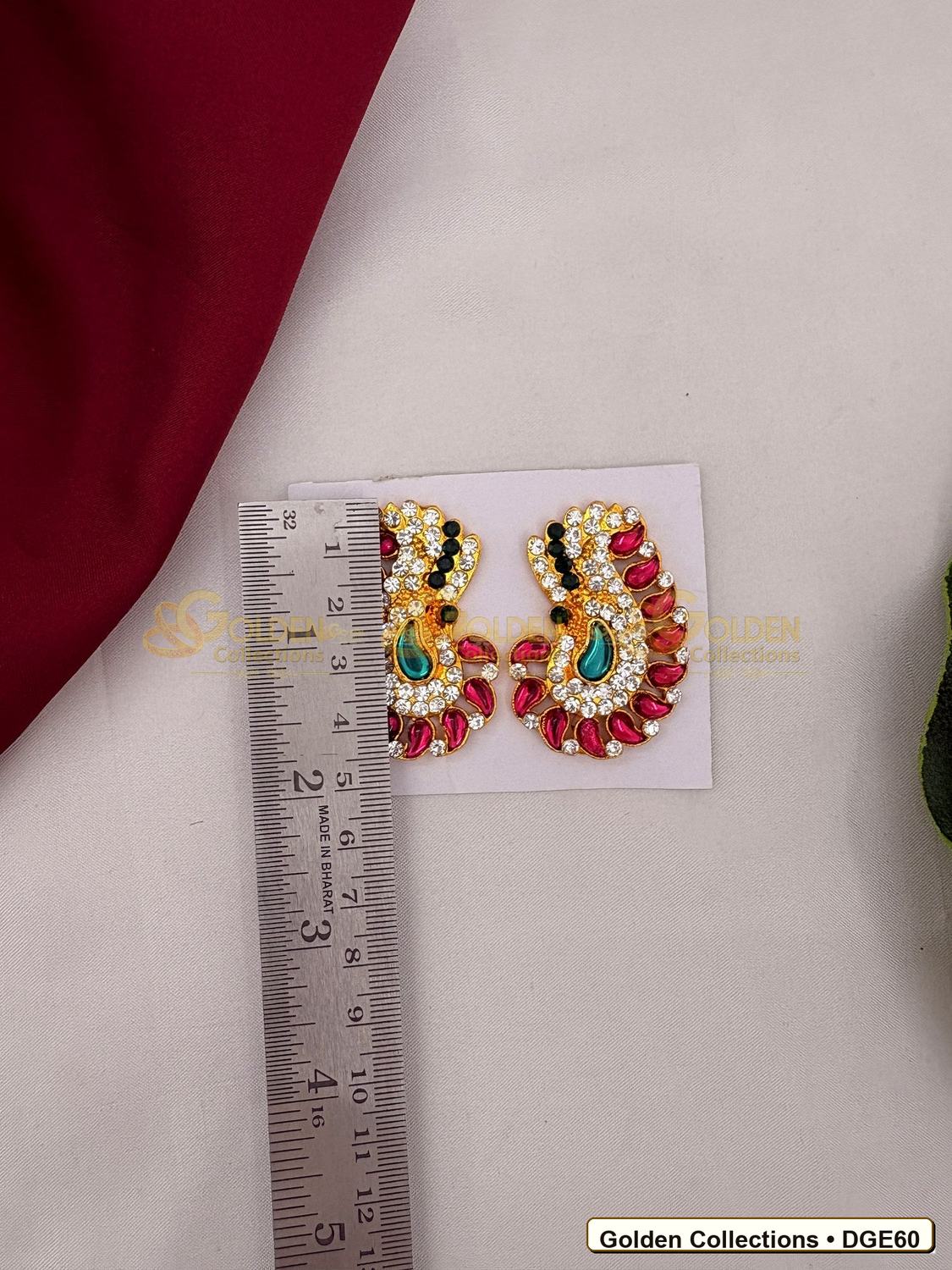 Close-up detail of Karna Pathakam Deity Earrings with Pink Green Stones 2 x 1 inches DGE60 from Golden Collections