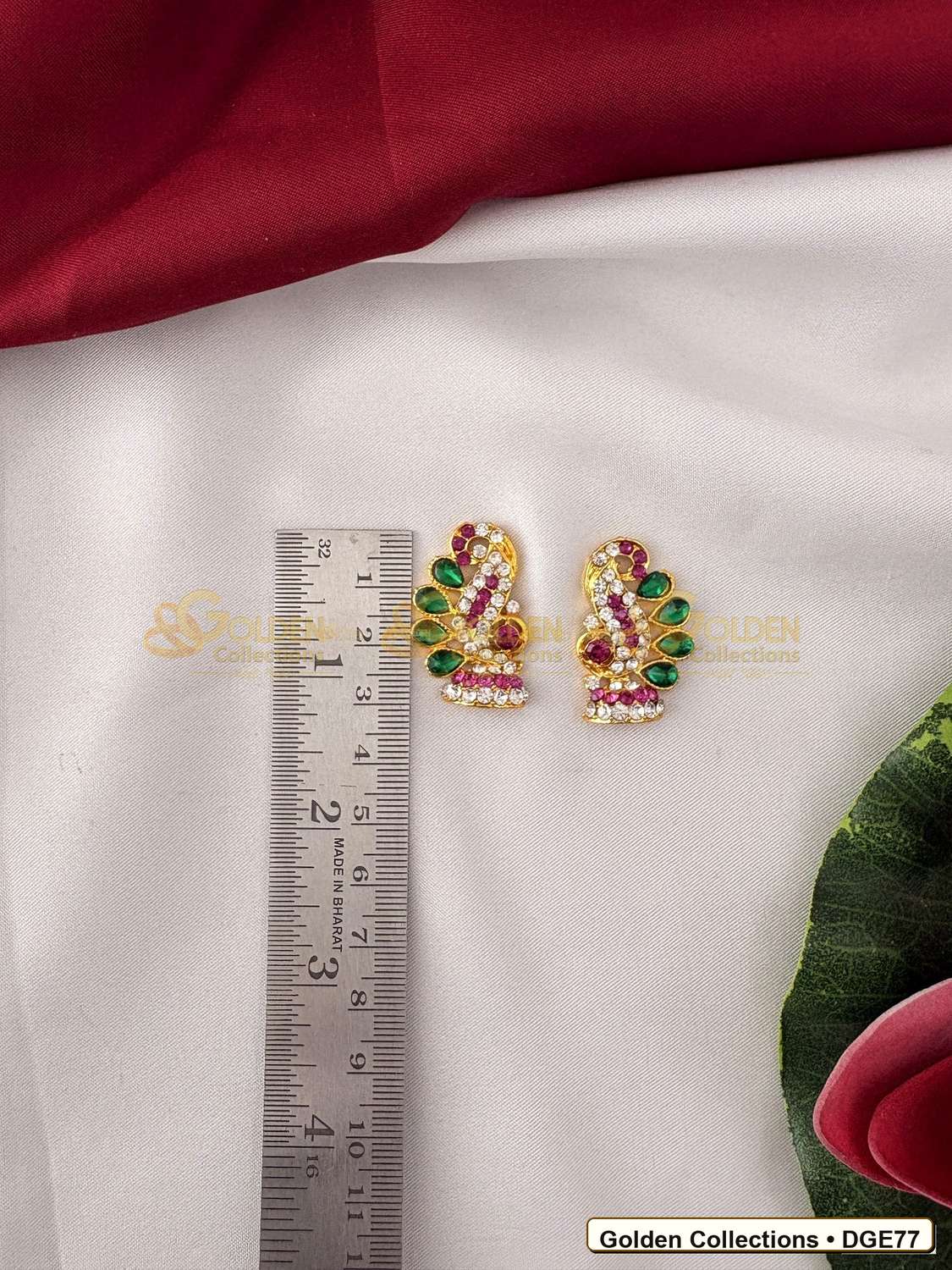 Close-up detail of Tiny Deity Earrings with Green Stones 1 x 0.75 inches DGE77 from Golden Collections