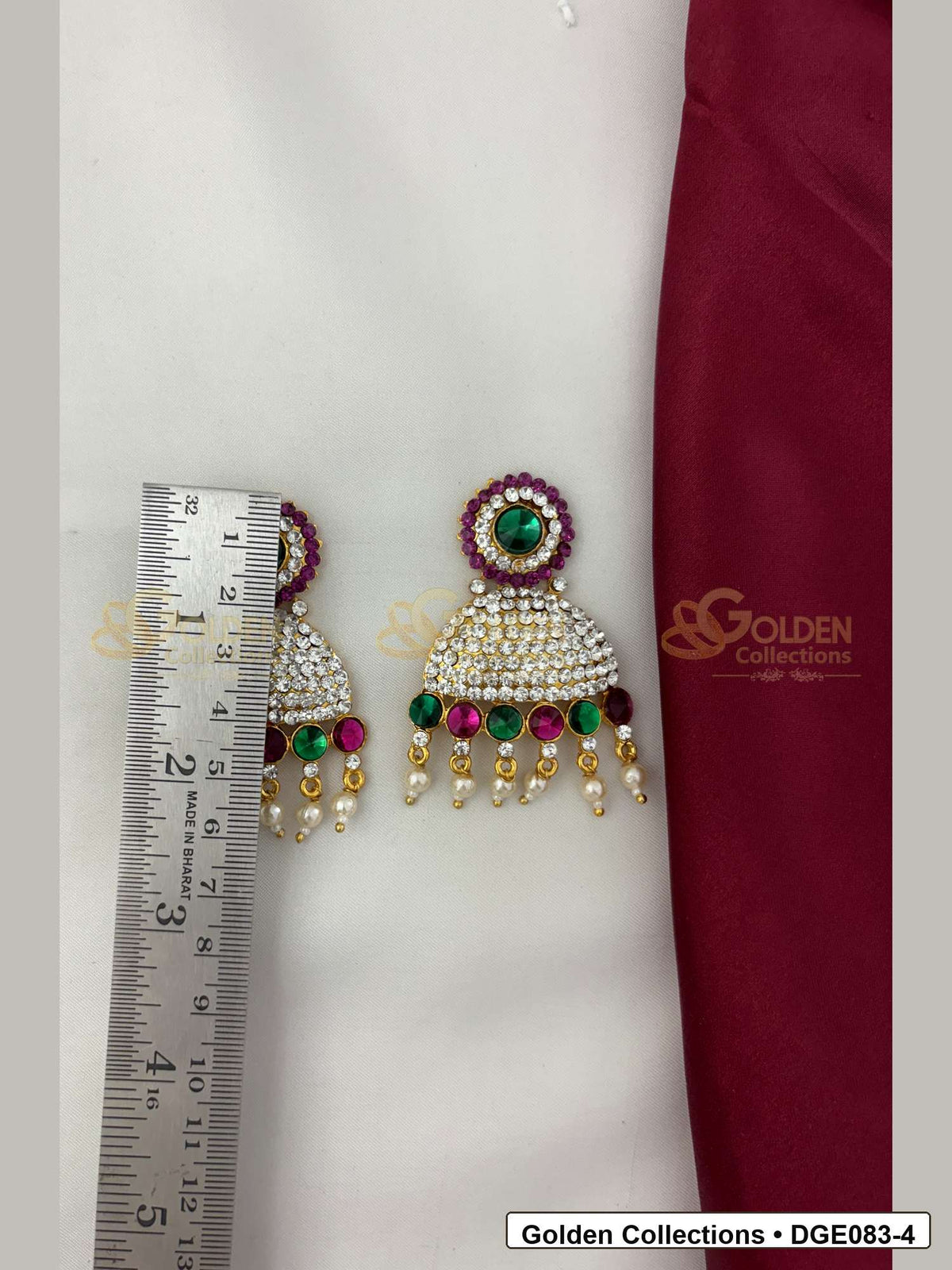 Measurement photo showing 6 Cms dome deity earrings with pink green stones for idol alankaram for deity idol alankaram
