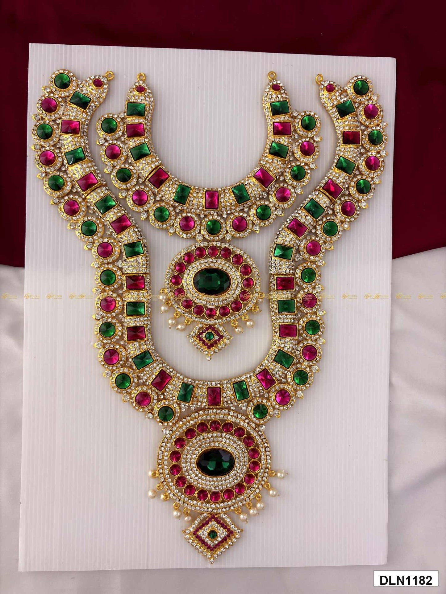 Front view of deity chest long haram with multicolor stones and gold plating for idol alankaram