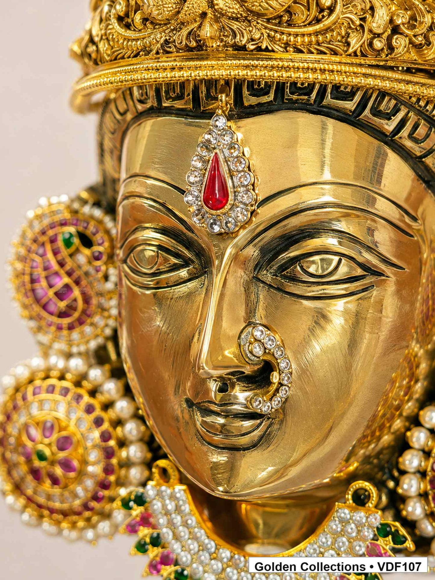 Brass Varalakshmi face with Pink Jadau Earrings and AD-stone necklace close-up