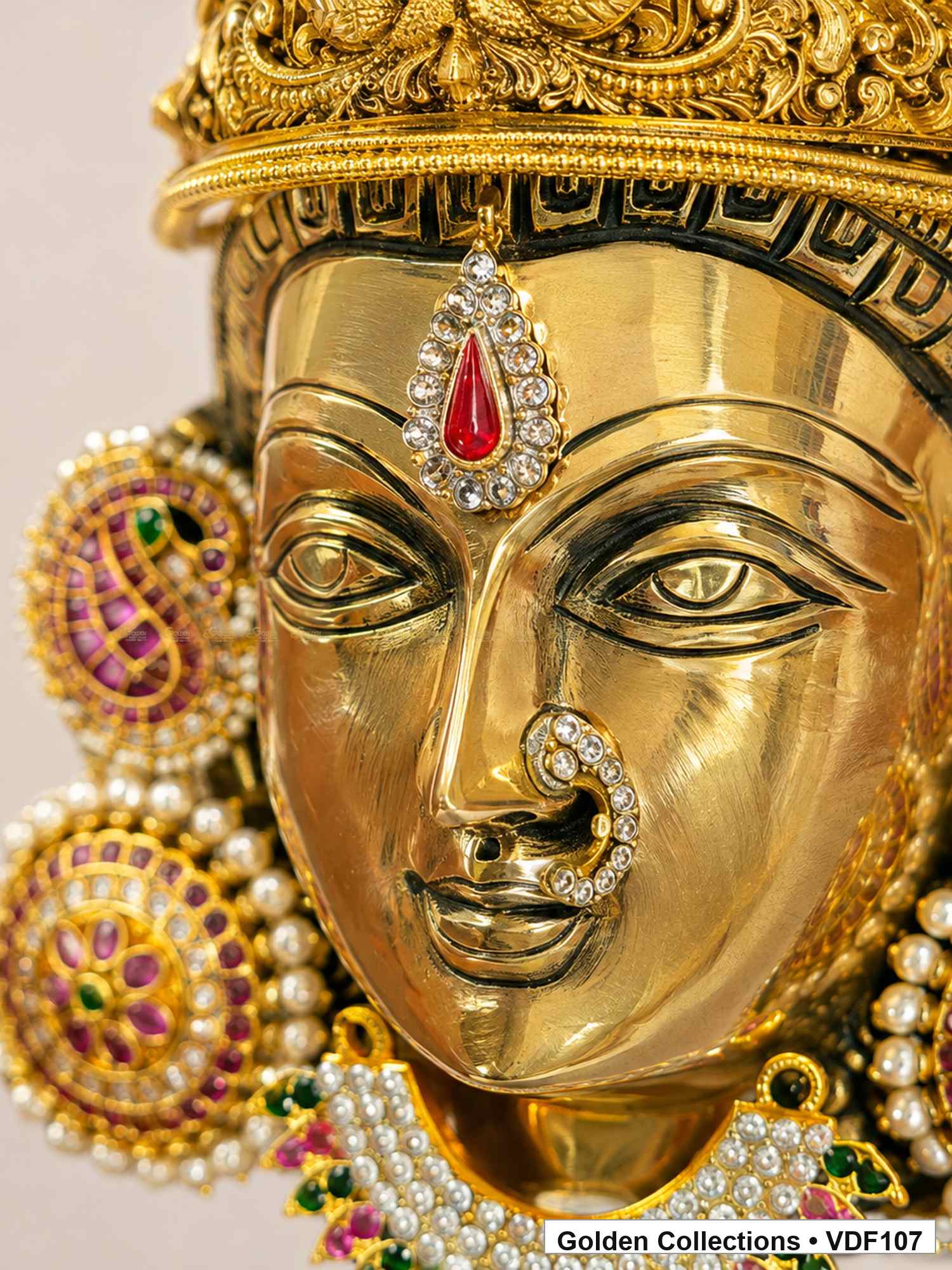 Brass Varalakshmi face with Pink Jadau Earrings and AD-stone necklace close-up